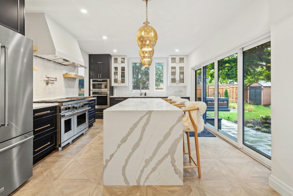 Luxury kitchen design trends 2026 smart kitchen with modern appliances large island and natural lighting